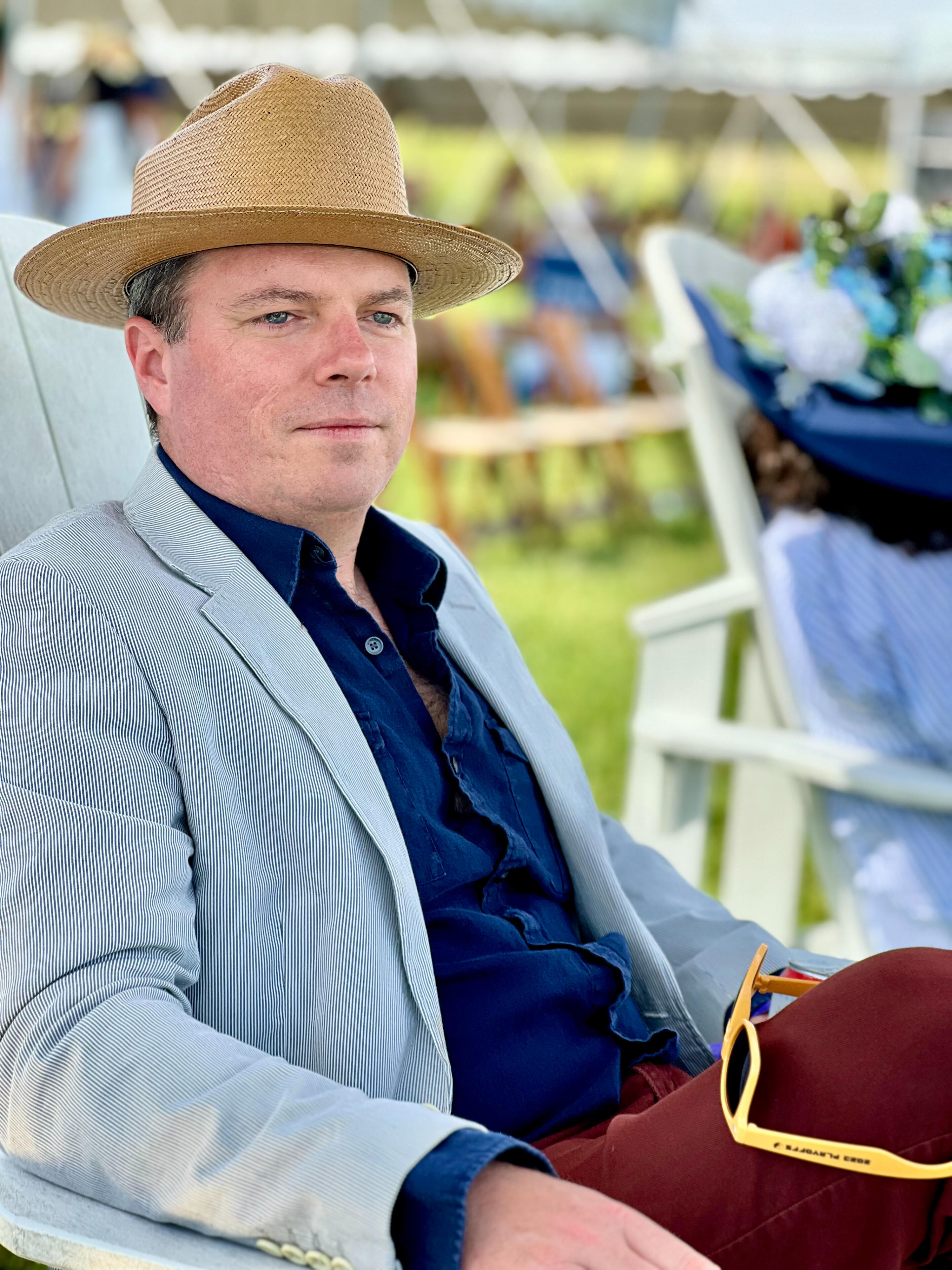 Toby Sells seated outdoors